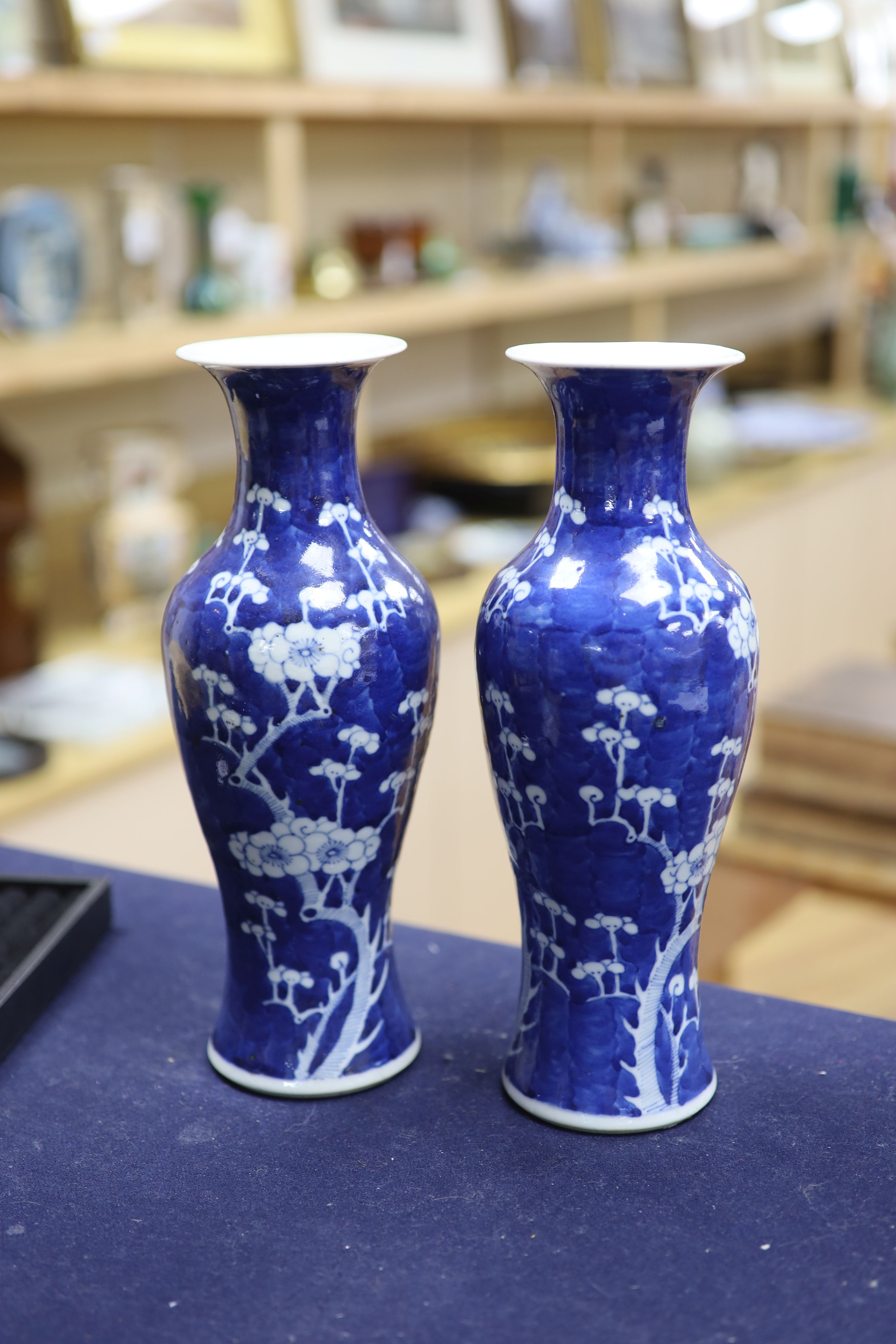 A pair of slender Chinese blue and white prunus vases, late 19th century, height 30cm